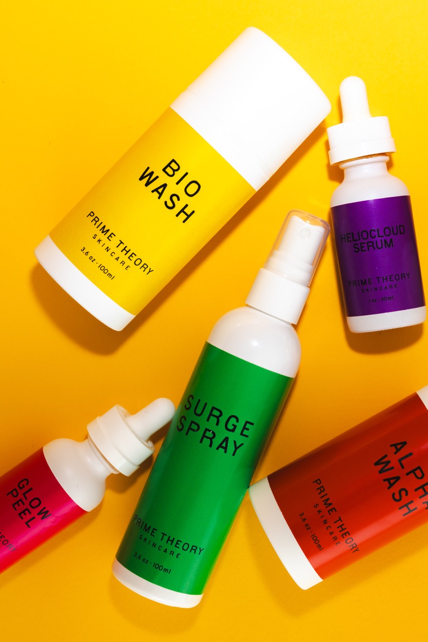 Prime Theory skincare products on yellow background