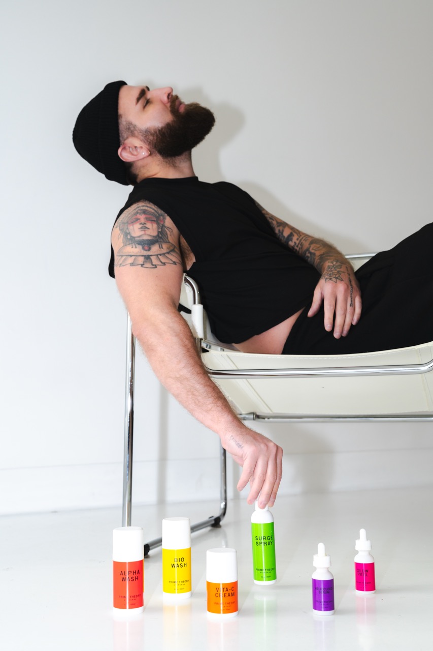 Prime Theory products displayed with model in chair