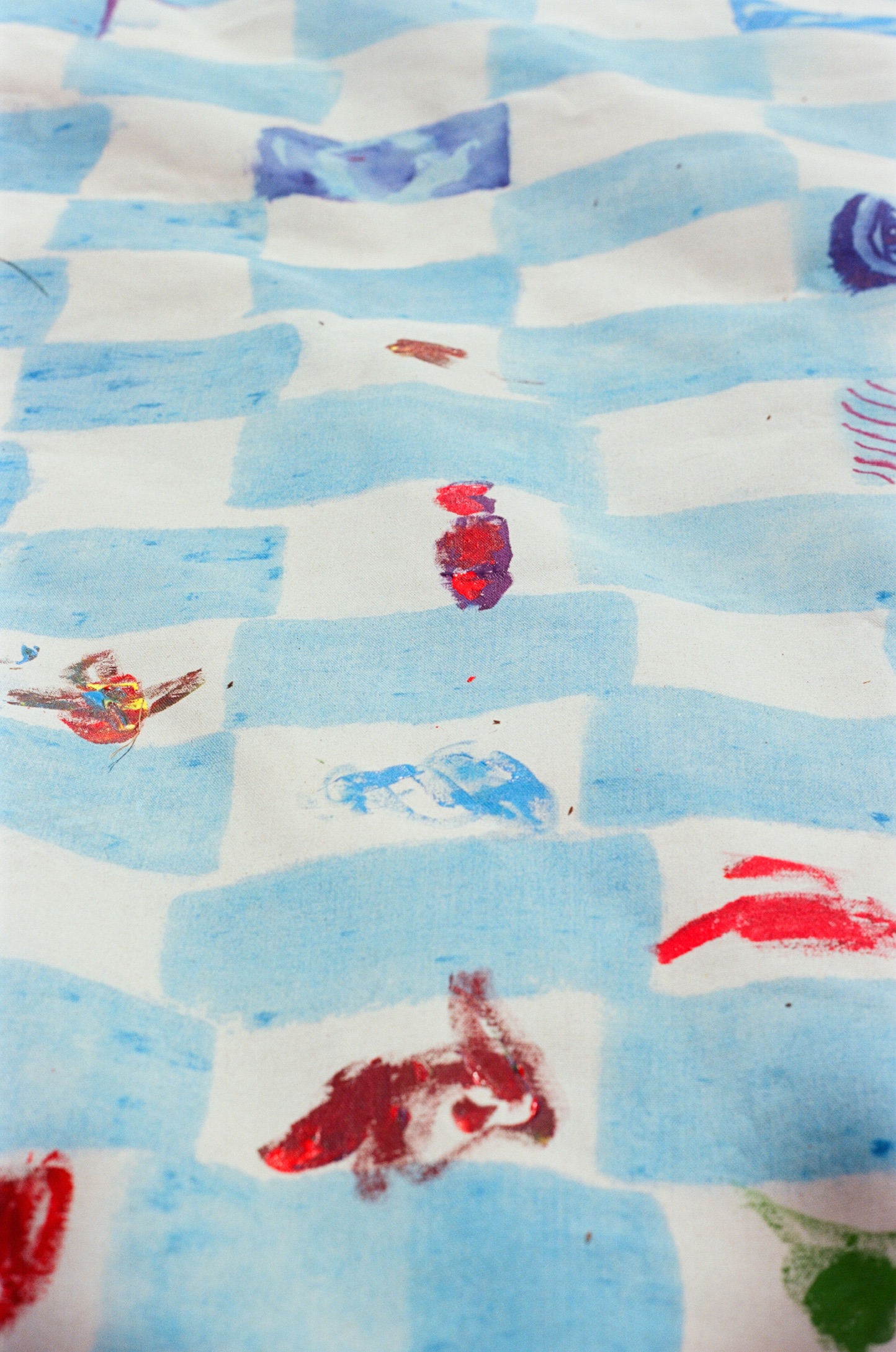 Painted marks on a blue Surface/Self canvas.